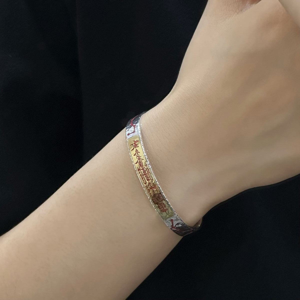 Men's Talisman Panel Cuff in Sterling Silver – contextual scene, on wrist with a black sleeve