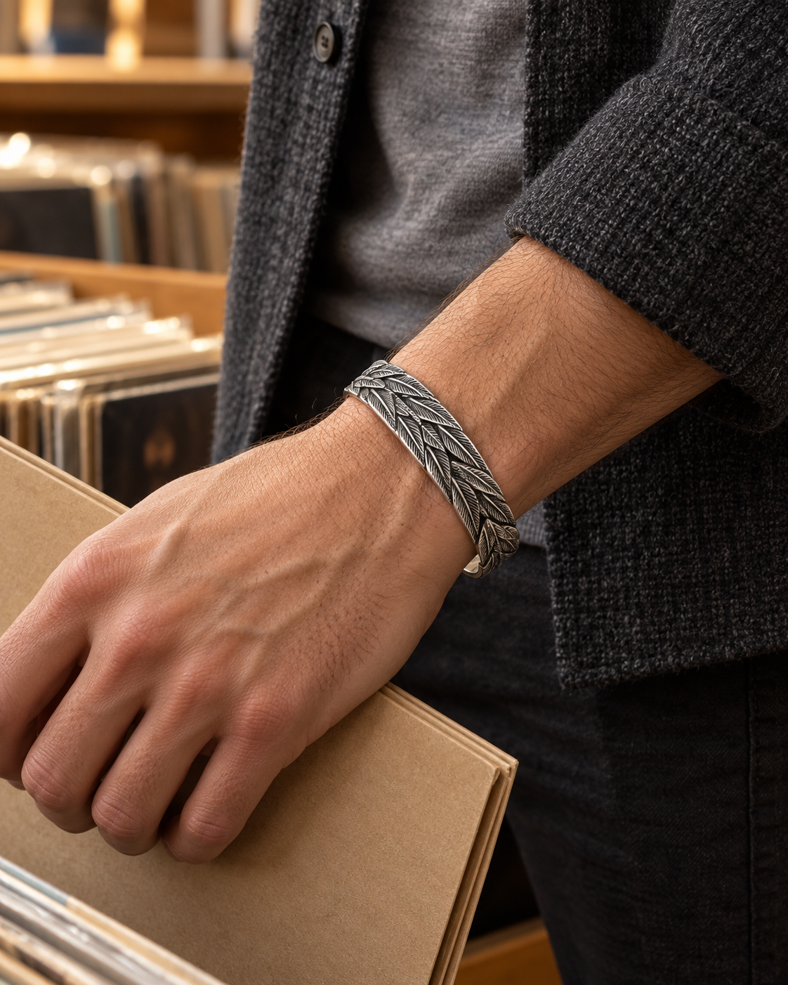 Men's Three Feather Sterling Silver Cuff in Sterling Silver – contextual scene, on wrist with a charcoal wool overshirt