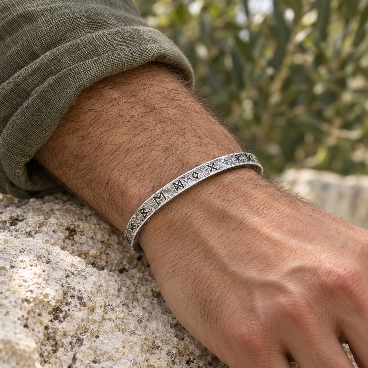 Men's Weathered Rune Cuff in Silver-Tone Steel – contextual scene, on wrist with olive linen