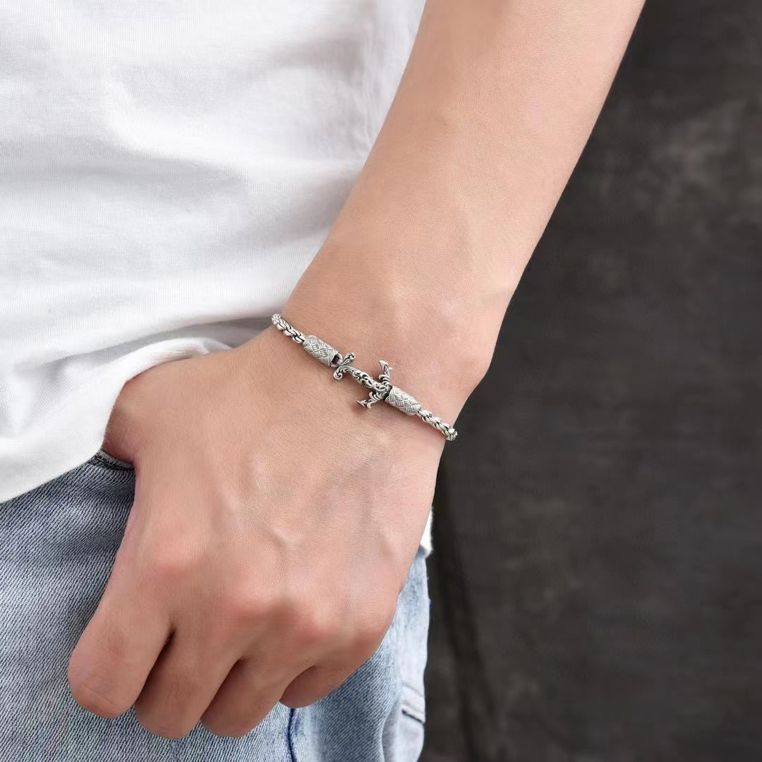 Men's Anchor Twist Bracelet in Sterling Silver – contextual scene, on wrist with a white shirt