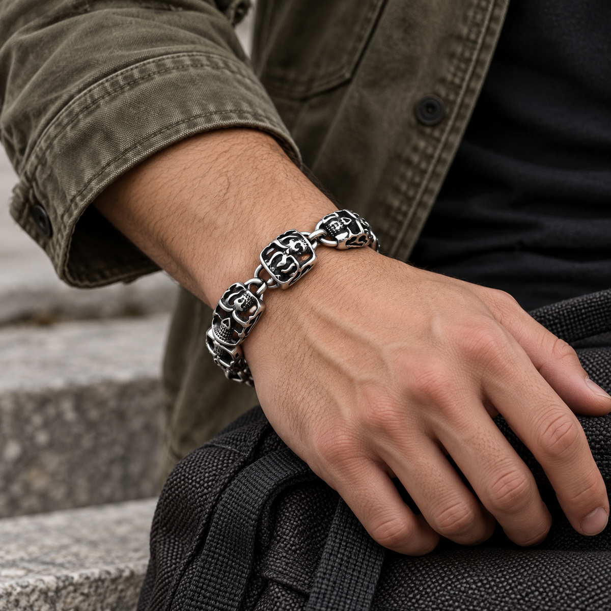 Men's Flame Skull Link Bracelet in Silver-Tone Steel – contextual scene, on wrist