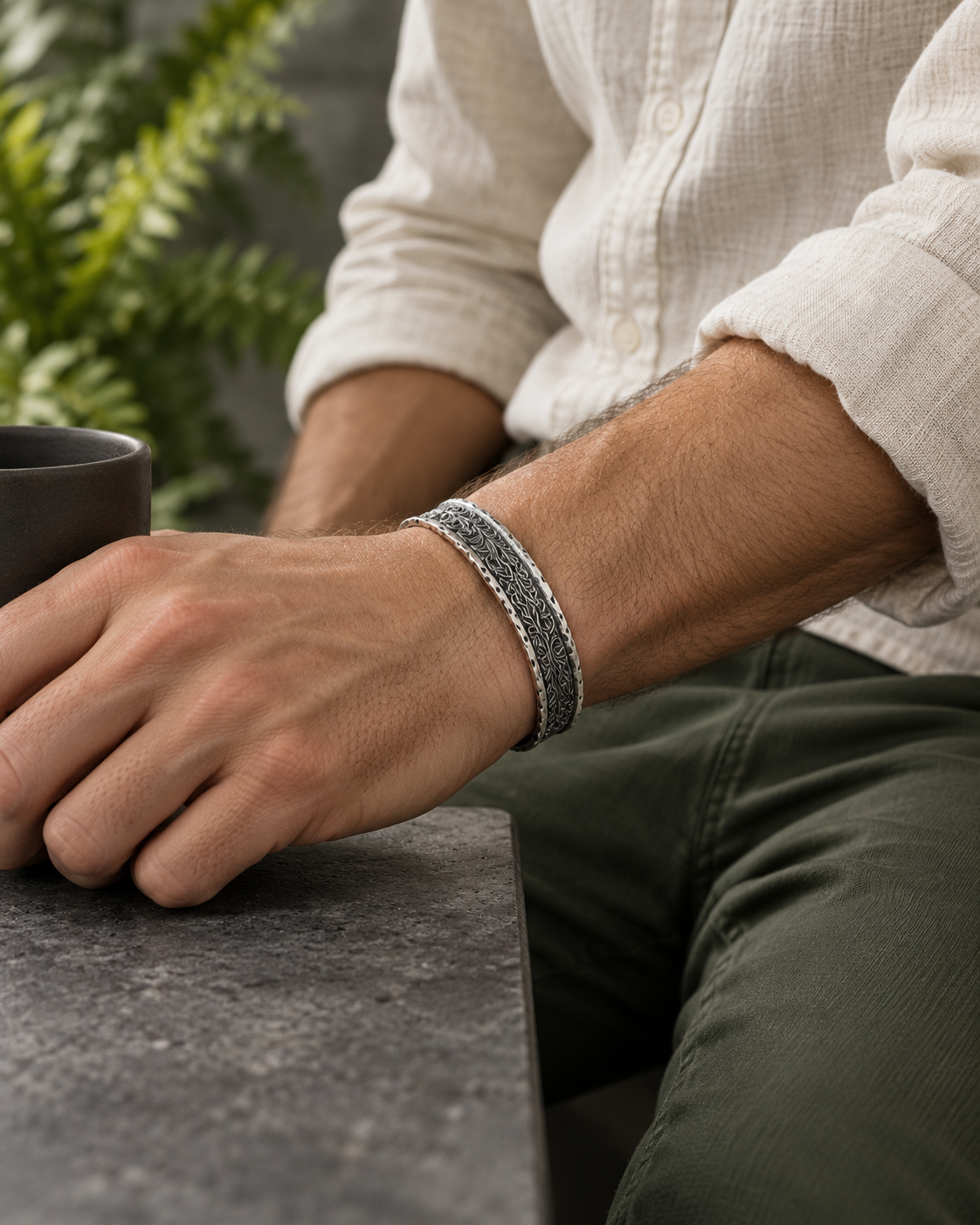 Men's Leaf Scroll Sterling Silver Cuff in Sterling Silver – contextual scene, on wrist