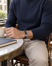 Blue Facet Bead Bracelet — contextual scene, torso and hands