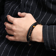 Men's Tiger Eye Braid Bracelet in black leather and tiger eye – on wrist