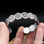 Men's Symbol Circle Cuff in Silver-Tone Steel – original hand-held view and dotted inner surface