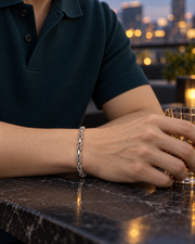 Men's Vajra Loop Bracelet in Sterling Silver – contextual scene, on wrist at an evening terrace