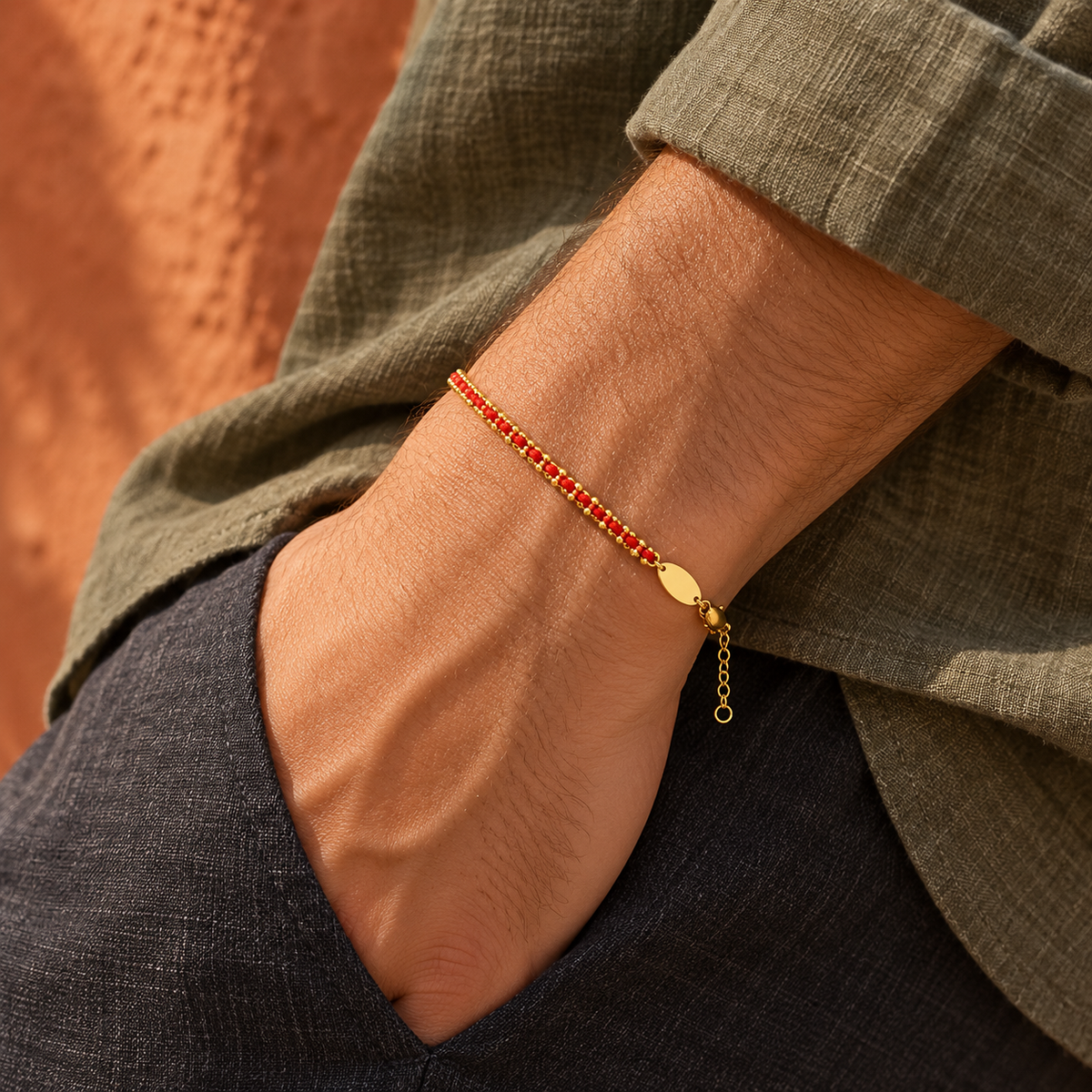 Men's Red Weave Gold Plated Bracelet in 18K Gold Plated Steel and Textile Cord – contextual scene, on wrist