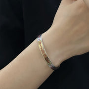 Men's Talisman Panel Cuff in Sterling Silver – contextual scene, on wrist with a black sleeve