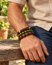 Men's Woodland Ten Bracelet Set in brown wood and coconut shell – on wrist,three bracelets selected from the ten-piece set