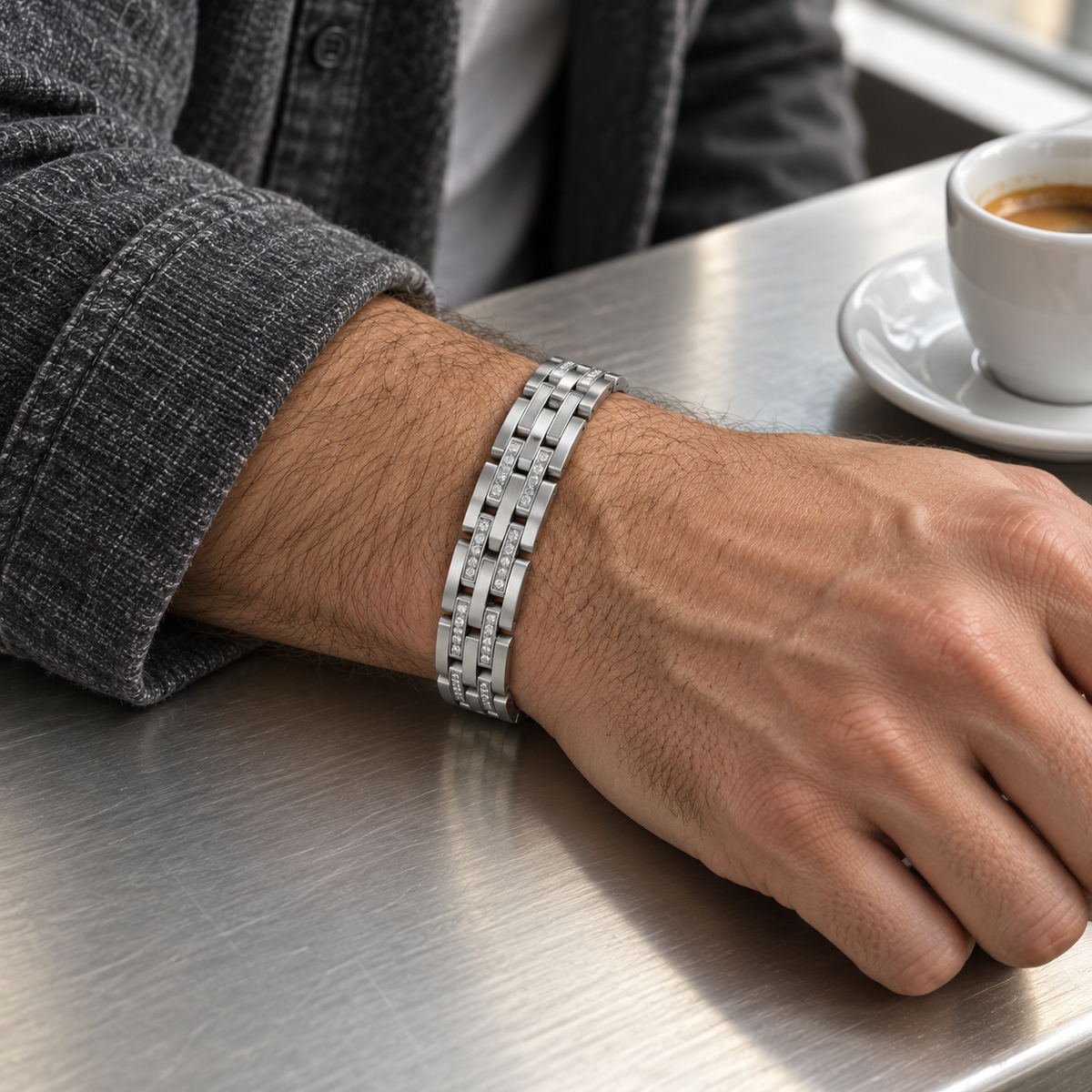 Men's Twin Rail Link Bracelet in Silver-Tone Steel – contextual scene, on wrist at a cafe counter