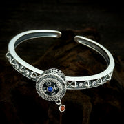 Men's Blue Wheel Cuff in Sterling Silver – side view of the open band and raised circular centerpiece
