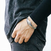 Men's Angular Relief Cuff in Sterling Silver – contextual scene, on wrist with black casual clothing