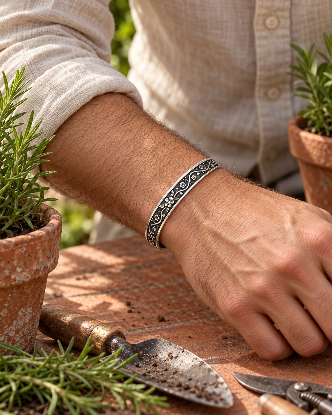 Men's Floral Vine Cuff in silver-tone Steel – contextual scene, on wrist