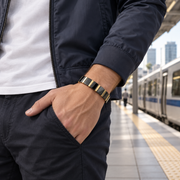 Men's Ceramic Panel Bracelet in Gold Plated Steel with Black Ceramic – on wrist in a contextual setting