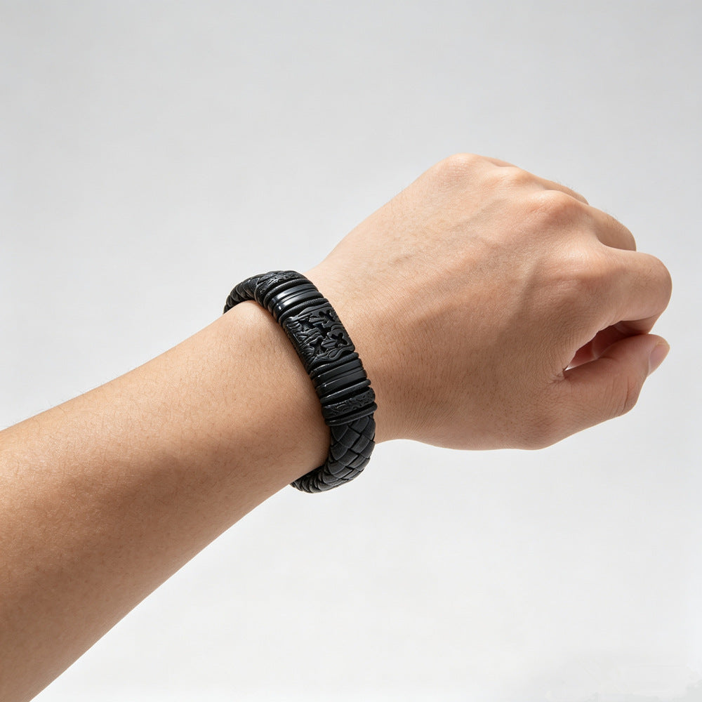 Men's Carved Barrel Braid Bracelet in Black – contextual scene, on wrist