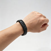 Men's Carved Barrel Braid Bracelet in Black – contextual scene, on wrist