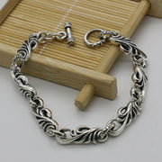 Men's Scroll Wing Bracelet in Sterling Silver – original scroll links and toggle detail