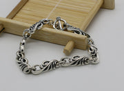 Men's Scroll Wing Bracelet in Sterling Silver – original angled detail