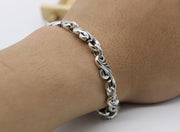 Men's Scroll Wing Bracelet in Sterling Silver – contextual scene, original on wrist