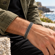 Men's Granular Texture Cuff in Sterling Silver – contextual scene, on wrist with an olive canvas overshirt