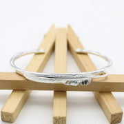 Men's Quill Line Cuff in Sterling Silver – original detail of the feather and band