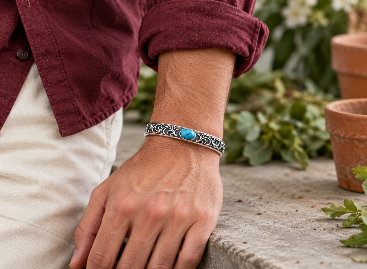 Men's Blue Scroll Sterling Silver Cuff in Sterling Silver – contextual scene, oxidized finish on wrist with burgundy cotton