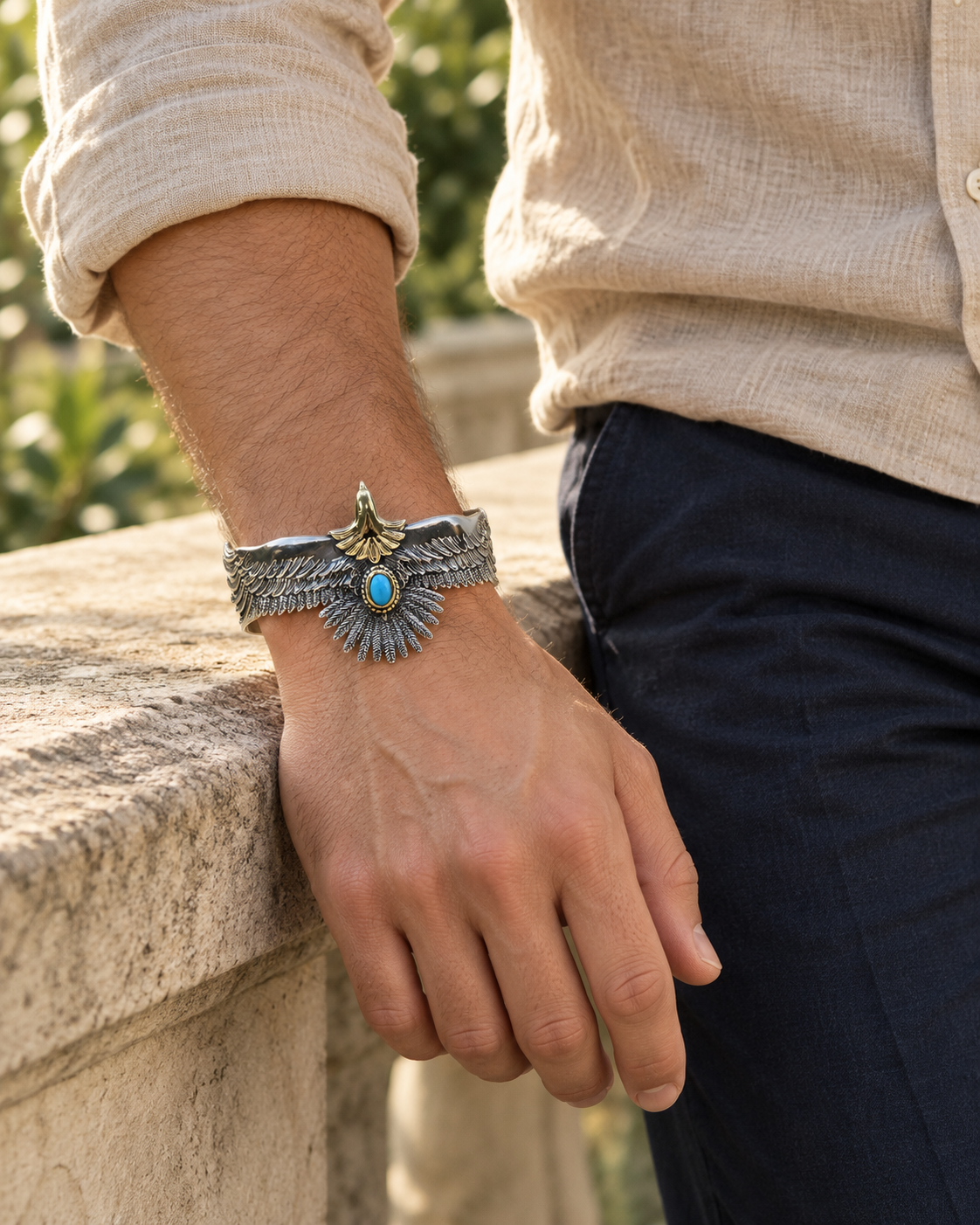 Men's Blue Eagle Cuff Bracelet in Sterling Silver with Blue Accent – contextual scene, on wrist with beige linen