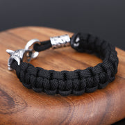 Men's Wolfhead Paracord Bracelet in black paracord and stainless steel – original side view of woven cord and clasp