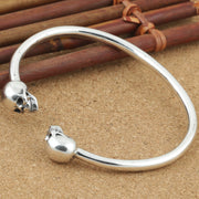 Men's Smooth Twin Skull Cuff in Sterling Silver – original skull ends and smooth rod detail