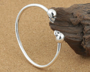Men's Smooth Twin Skull Cuff in Sterling Silver – original side view of the open cuff