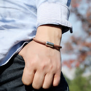Men's Plain Leather Cord Bracelet in Brown – contextual scene, on wrist