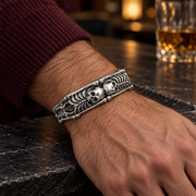 Men's Twin Skeleton Cuff in Sterling Silver – contextual scene, on wrist beside a dark slate counter