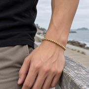 Men's Gold Globe Bead Bracelet in Gold Plated 925 Sterling Silver – contextual scene, on wrist