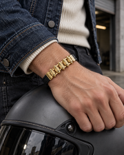 Men's Roller Braid Faux Leather Bracelet in Black and Gold Plated Steel – contextual scene, on wrist with indigo denim and a graphite helmet