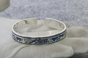 Men's Blue Wilderness Cuff in Silver-Tone / Blue – original gloved-hand view and physical S925 stamp