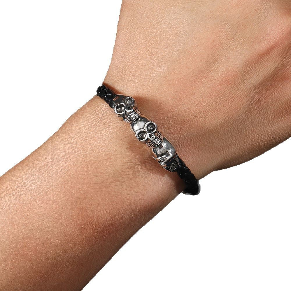 Men's Three Skull Braid Bracelet in Black – contextual scene, on wrist