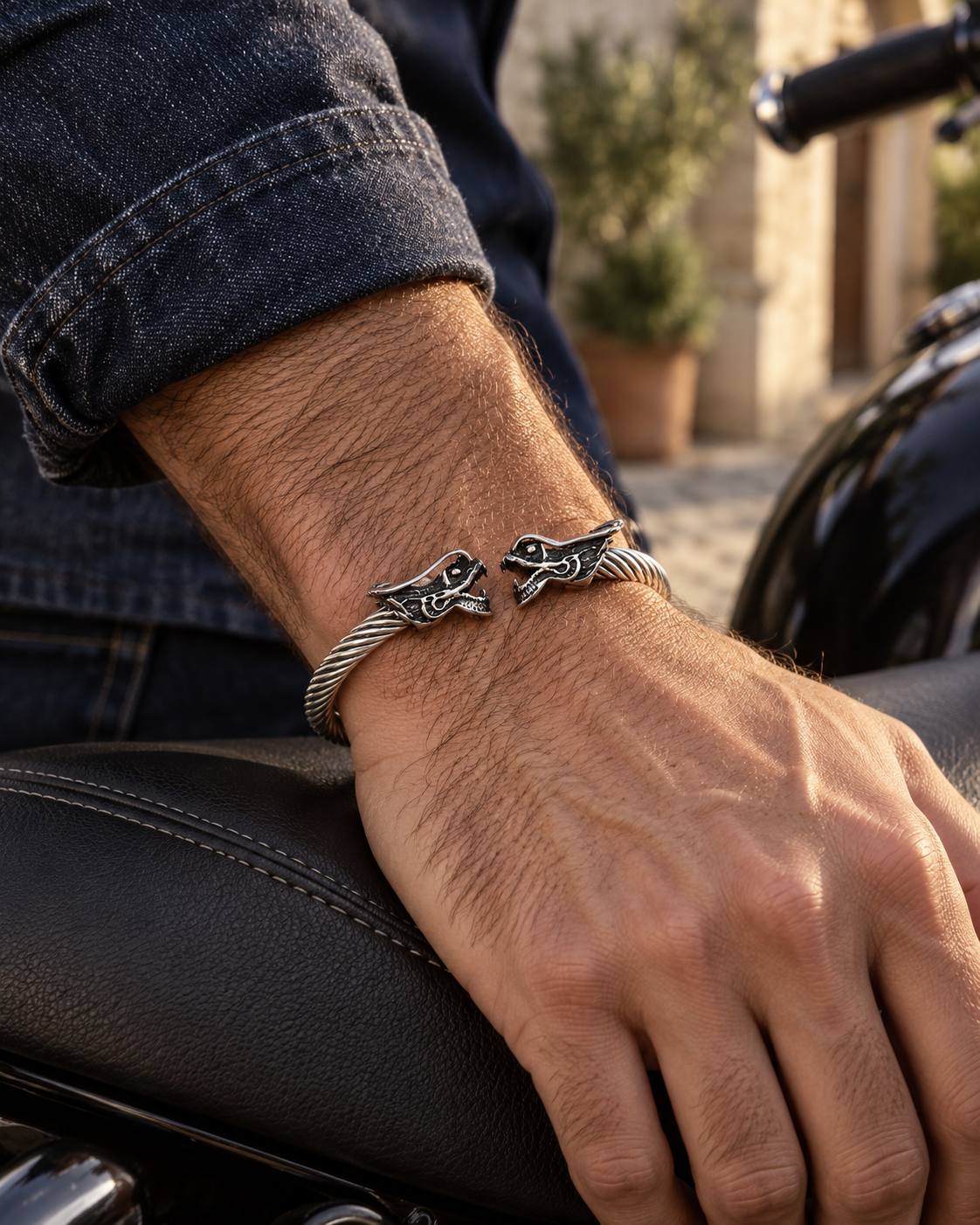Men's Twin Dragon Cable Cuff in Silver-Tone Steel – contextual scene, on wrist beside a motorcycle