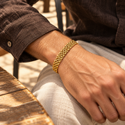 Men's Flat Weave Gold Plated Bracelet in 18K Gold Plated Steel – contextual scene, on wrist