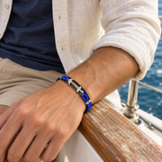 Men's Blue Loop Anchor Faux Leather Bracelet in Black and Blue Faux Leather, Textile Cord and Steel – contextual scene, on wrist