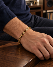 Men's Golden Box Weave Bracelet in gold-tone stainless steel – on wrist with navy knitwear