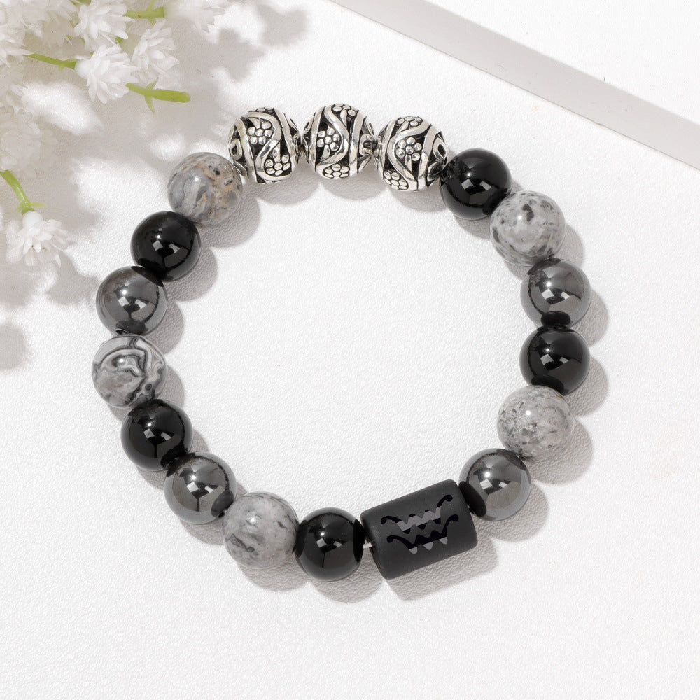 Men's Zodiac Cylinder Bracelet in black and grey decorative glass beads – original detail, Aquarius beads and patterned spacers