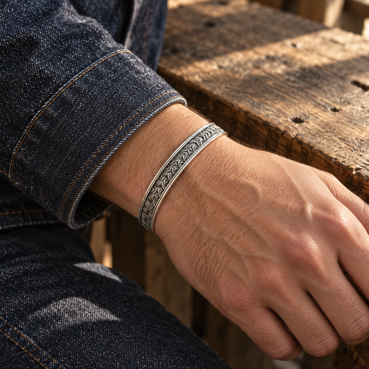 Men's Interlace Scale Cuff in Sterling Silver – contextual scene, on wrist with an indigo denim sleeve