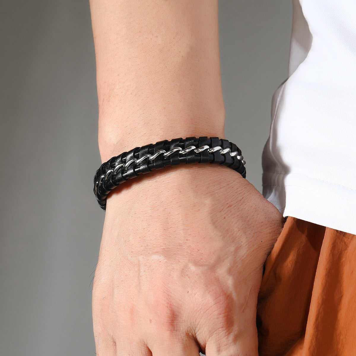 Men's Laced Chain Faux Leather Bracelet in Black – contextual scene, on wrist