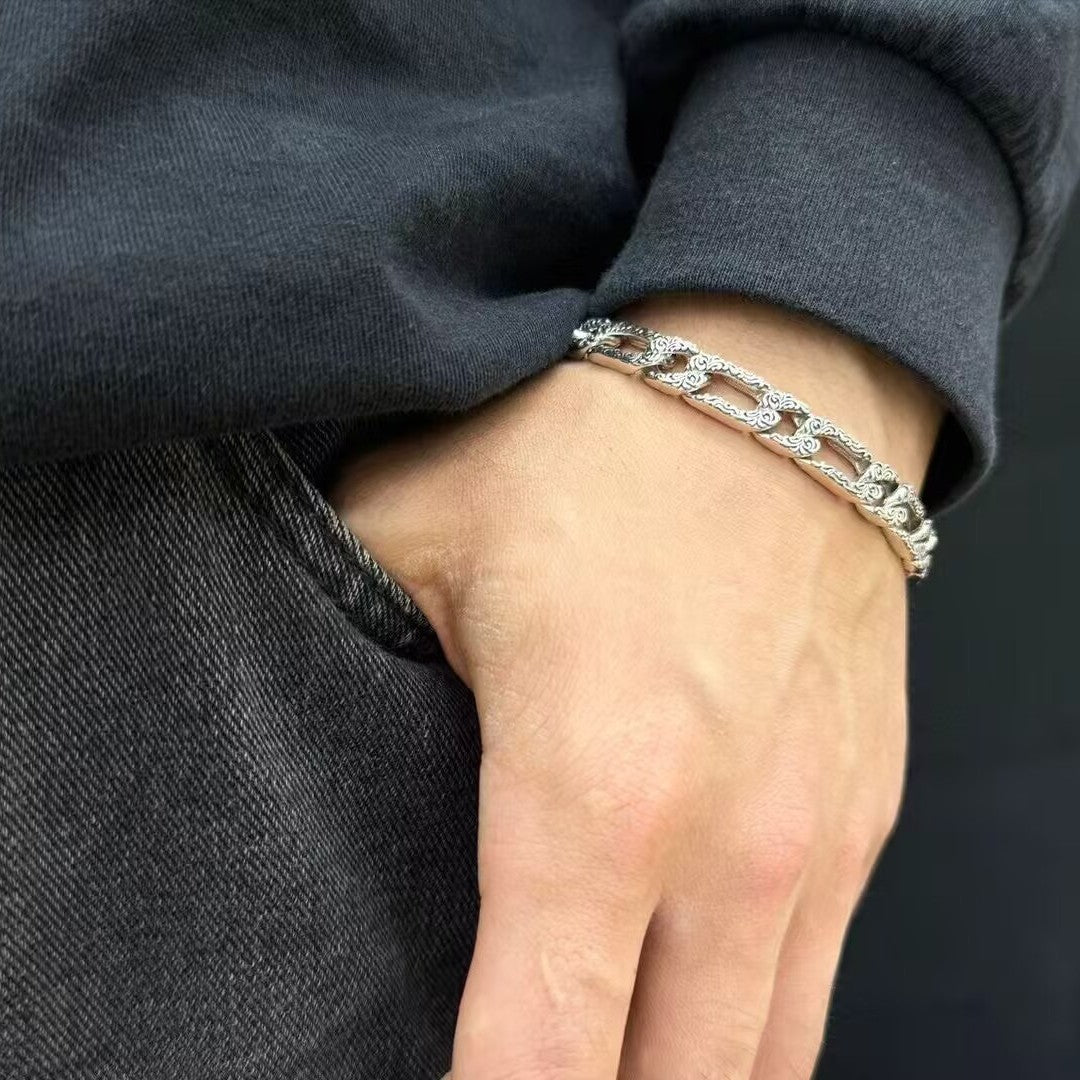 Men's Scroll Cutout Sterling Silver Chain Bracelet in 925 Sterling Silver – contextual scene, on wrist