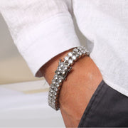 Men's Double Brilliance Tennis Bracelet in Silver-Tone – contextual scene, on wrist with a white shirt and charcoal trousers