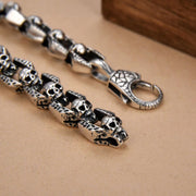 Men's Open Bone Skull Bracelet in Silver-Tone Steel – original skull, open angular panel and patterned clasp detail