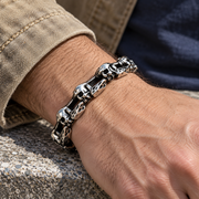 Men's Open Bone Skull Bracelet in Silver-Tone Steel – contextual scene, on wrist