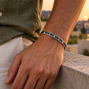 Men's Celestial Line Cuff in stainless steel – on wrist with moss-green linen