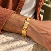 Men's Brushed Rail Link Bracelet in Gold Plated Steel; Clear Stones – contextual scene, on wrist