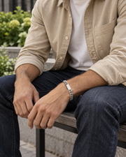 Oval ID Curb Bracelet — contextual scene, torso and hands